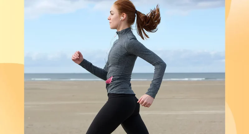 Woman power walking on the beach.
