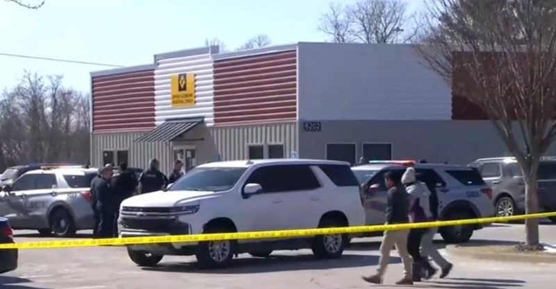Crime scene at Louisville DMV following a shooting.