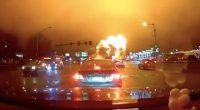 Dashcam footage of a large fire at an intersection.