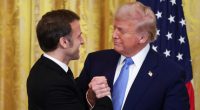 President Trump and President Macron shaking hands.