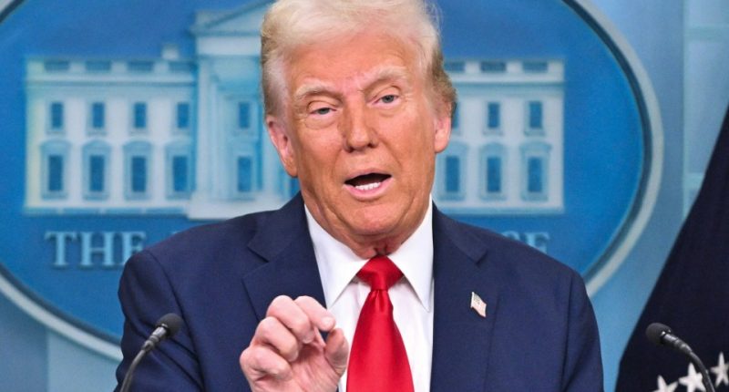 Donald Trump speaking at a press briefing.