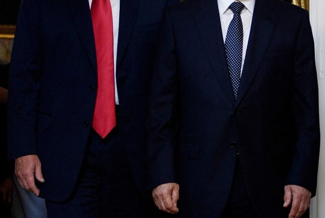 Donald Trump and Vladimir Putin in suits.