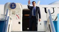 Secretary of State Marco Rubio waving goodbye from an airplane.