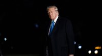 Donald Trump walking at night.