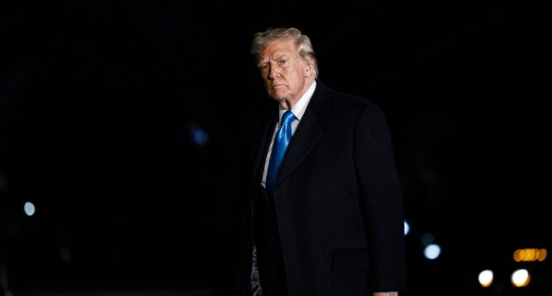 Donald Trump walking at night.
