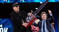Elon Musk holding a chainsaw at CPAC.