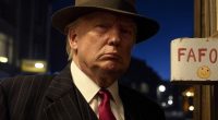 Donald Trump in a pinstripe suit and fedora.