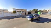 A police car parked outside a house in San Fulgencio, Spain.