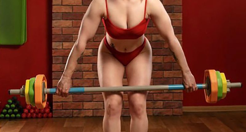 Ukrainian powerlifting champion Yulia Lemeshchenko holding a barbell.