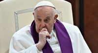 Pope Francis seated, appearing pensive.
