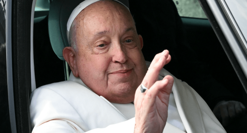 Pope Francis waving from a car.