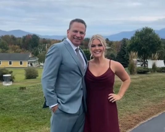 Karoline Leavitt and her husband Nicholas at an outdoor event.