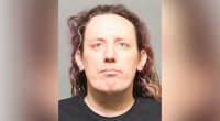 Woman arrested after explosives discovered at Tesla dealership
