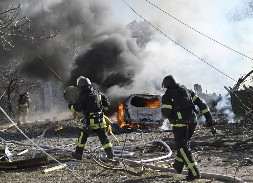 Firefighters at the site of a strike in Kramatorsk, Ukraine.