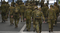 Members of the Australian Defence Force walk through the city on July 27, 2020 in Melbourne, Australia. Victoria has recorded 532 new cases of coronavirus and six more deaths.