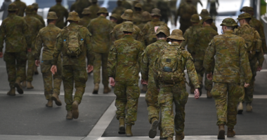 Members of the Australian Defence Force walk through the city on July 27, 2020 in Melbourne, Australia. Victoria has recorded 532 new cases of coronavirus and six more deaths.