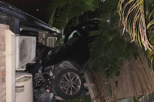 A car has crashed through a family's new home in southern Brisbane, narrowly missing their two-year-old son and leaving them without power or water.