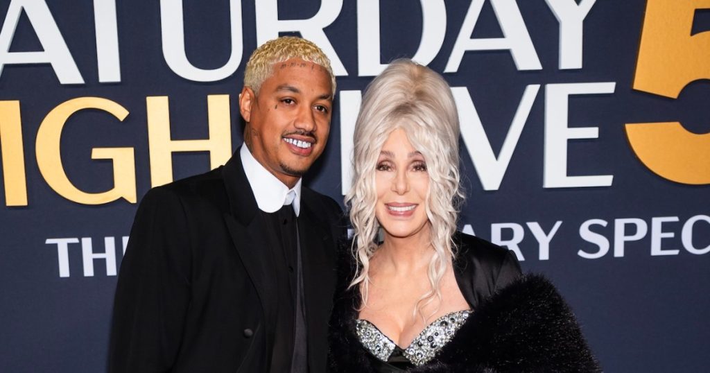 Cher and AE Edwards Enjoy Loved-Up ‘SNL 50’ Red Carpet Appearance