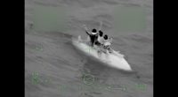 Coast Guard crews rescue three boaters stuck at sea for 9 hours after their boat capsizes