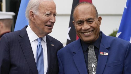 President Joe Biden talks with Kiribati's President Taneti Maamau as they stand for a family photo with Pacific Islands Forum leaders at the White House in Washington, in 2023