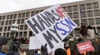 People protest during a rally against Elon Musk outside the U.S. Department of Labor in Washington, Wednesday, Feb. 5, 2025. (AP Photo/Jose Luis Magana)