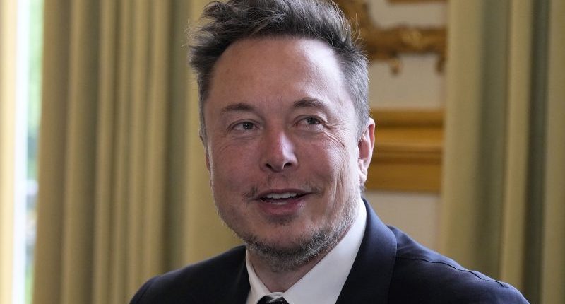 Elon Musk perched behind Trump's desk in new TIME Magazine cover