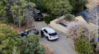 Law enforcement officials talk outside the home of actor Gene Hackman on Thursday, Feb. 27, 2025 in Santa Fe, New Mexico