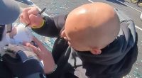 Incredible moment Eagles star Zack Baun signs a fan's baby during wild Super Bowl parade