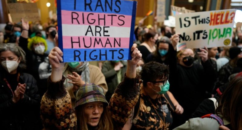 Iowa's governor signs a bill removing gender identity protections from the state’s civil rights code