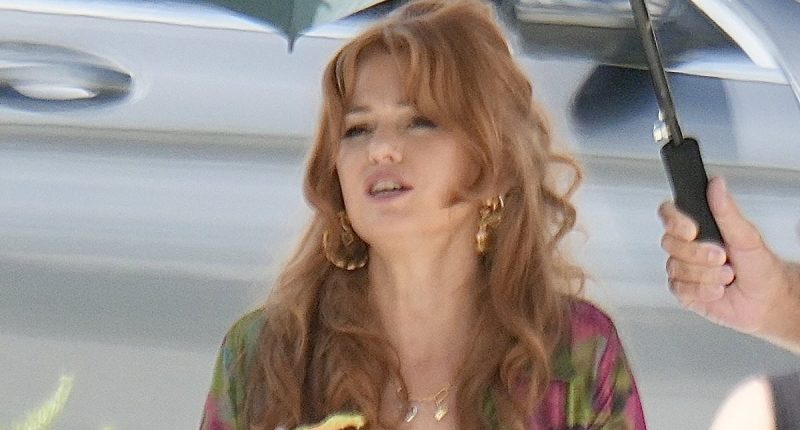 Isla Fisher puts on a busty display as she scoffs a bowl of food