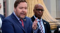 Acting U.S. Attorney Joseph T. McNally, left, and FBI Assistant Director Akil Davis discuss court filings related to the Palisades Fire investigation outside the U.S. Courthouse in downtown Los Angeles on Friday, Jan. 31, 2025. (AP Photo/Damian Dovarganes)