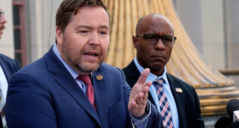Acting U.S. Attorney Joseph T. McNally, left, and FBI Assistant Director Akil Davis discuss court filings related to the Palisades Fire investigation outside the U.S. Courthouse in downtown Los Angeles on Friday, Jan. 31, 2025. (AP Photo/Damian Dovarganes)