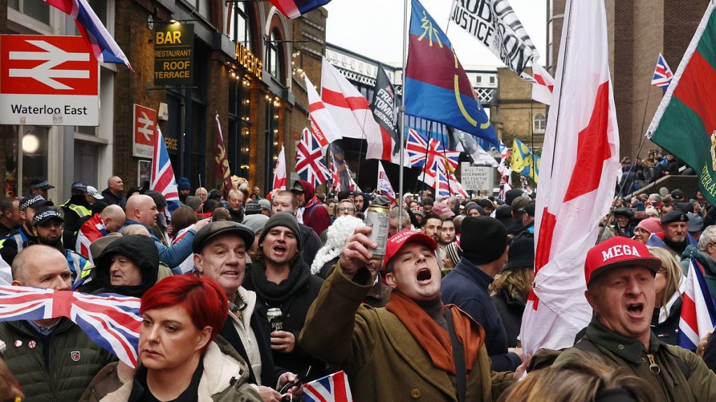Met Police arrest five as Tommy Robinson supporters invade Stand Up To Racism counter-demo area as rival protests fill central London