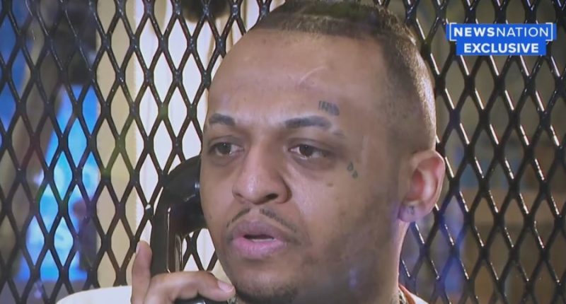 inmates close up with phone to his ear
