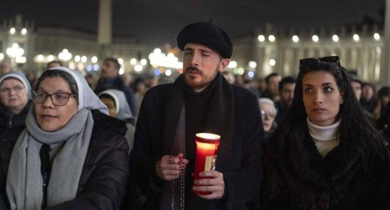 Catholic faithful attend a nightly rosary prayer service for the health of Pope Francis in St. Peter's Square at the Vatican. (AP Photo/Mosa'ab Elshamy)