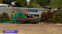 A Willaston resident was confronted by an axe-wielding driver who smashed into his backyard during a wild police chase.