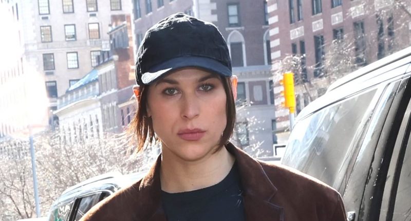 Tommy Dorfman reveals racy thigh tattoo at Coach fashion show in NYC