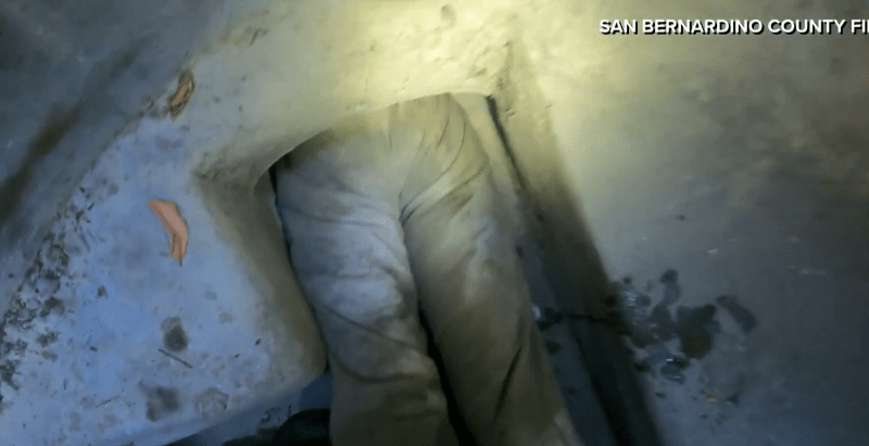 Video: Woman pulled from tight storm drain in California