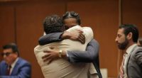 Watch moment A$AP Rocky hugs sobbing Rihanna as he dives over court bench after being found NOT GUILTY in gun trial