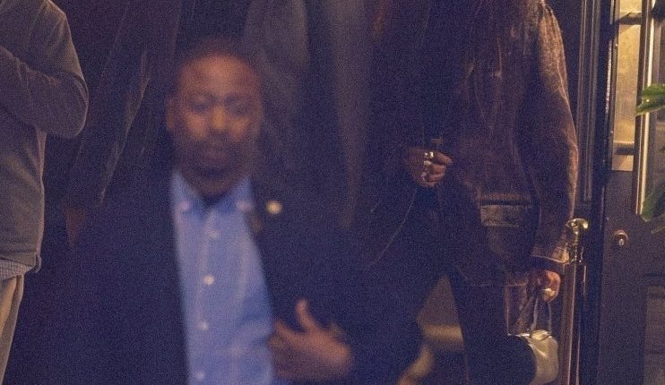 Michelle Obama and her brother Craig Robinson leaving a restaurant.