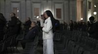 A Catholic nun crosses herself during a prayer of the Rosary for Pope Francis in St. Peter's Square at The Vatican, Sunday, March 9, 2025. (AP Photo/Francisco Seco)