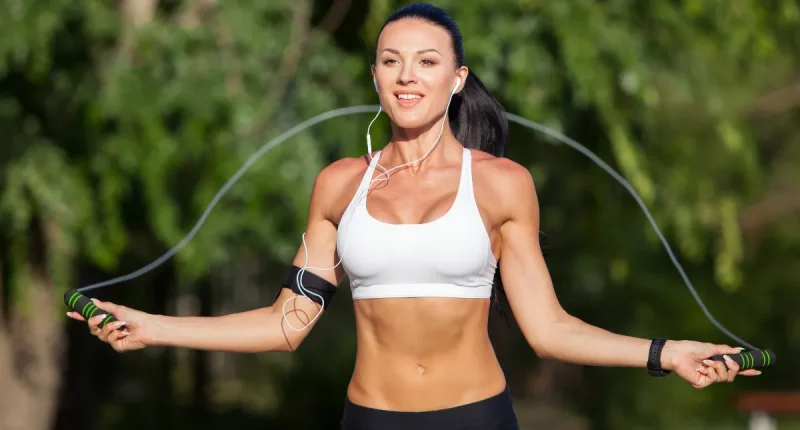 fit woman jumping rope for weight loss, concept of lose belly fat in 30 days