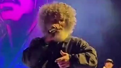 90s rock singer unrecognizable with curly hairdo... can you guess who?