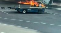 American Airlines plane on fire at an airport.