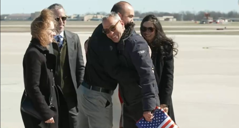 American released by Taliban returns home to 'champion's welcome'