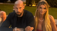 Couple sitting at a table outdoors.