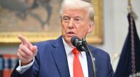 President Trump speaking at a microphone.