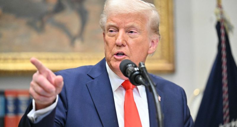 President Trump speaking at a microphone.