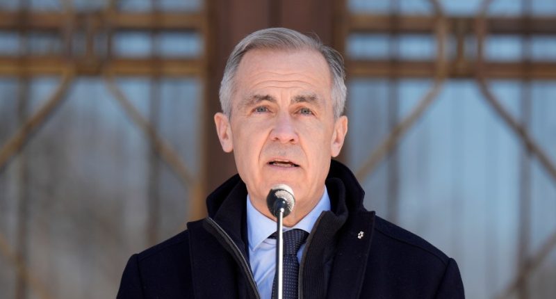 Prime Minister Mark Carney speaking at a microphone.