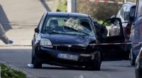 Damaged car at a crime scene.